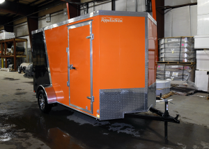 Front of orange and black single axle trailer