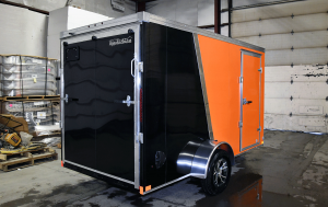 Rear view of black and orange single axle professional series trailer