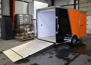 open back of orange and black single axle trailer
