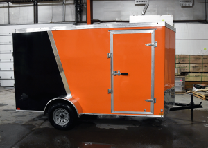 side of orange and black single axle trailer