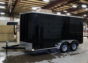 side of black tandem axle trailer