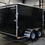 closed rear of black tandem axle trailer