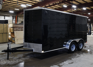 side of black tandem axle trailer