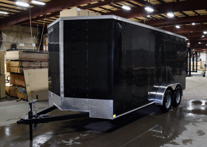 side of black tandem axle trailer