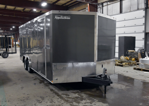 front of grey tandem axle trailer