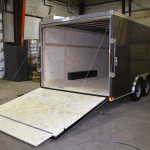 rear of grey tandem axle trailer